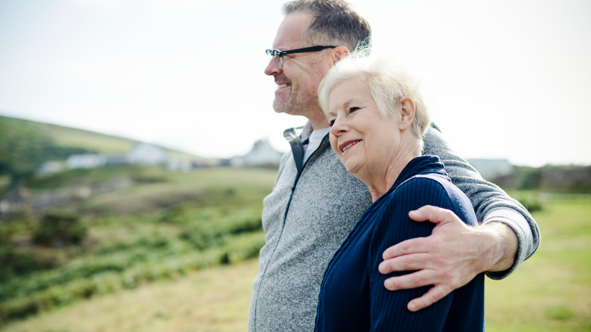 Man and woman hug outdoors